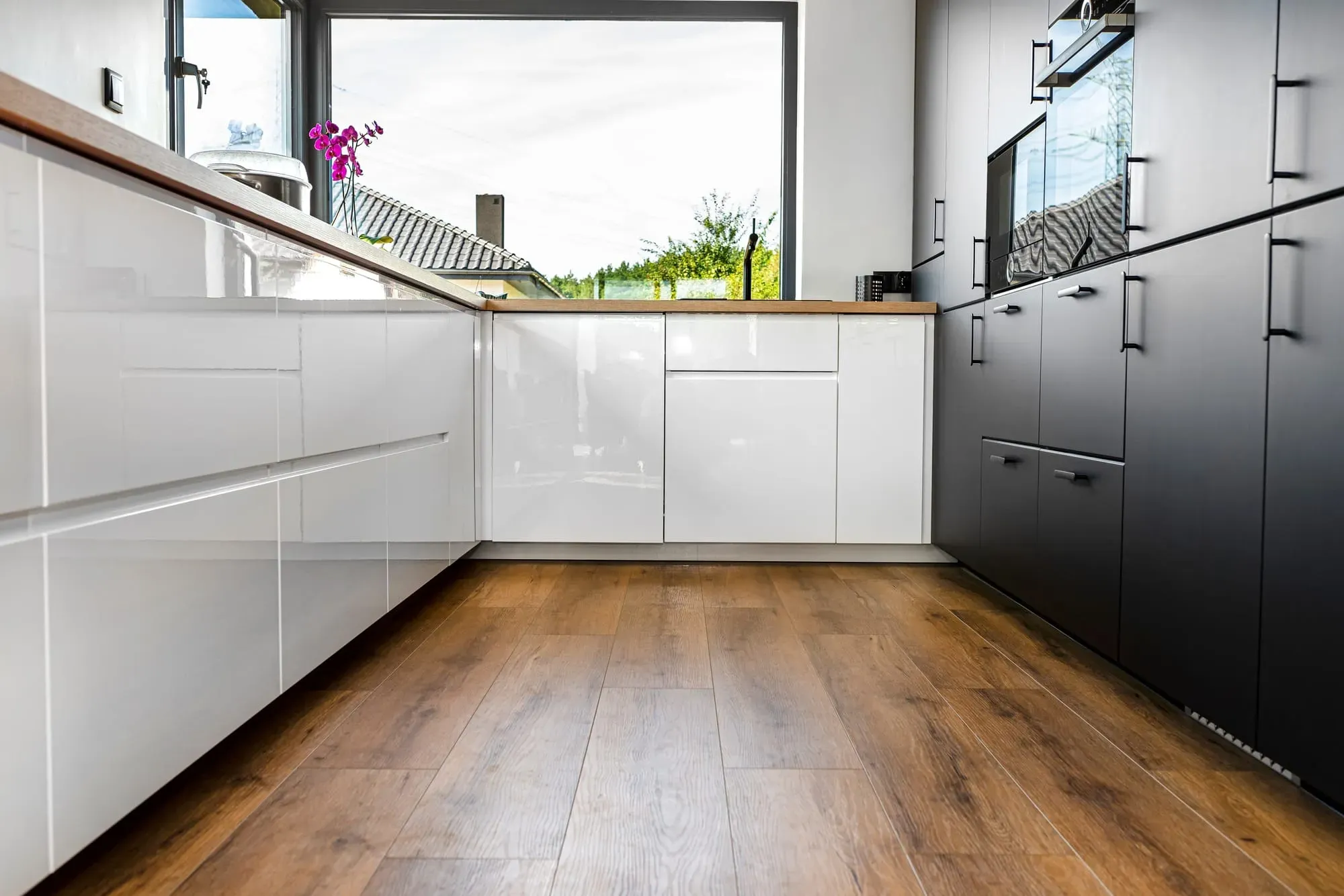 Close-up of hypoallergenic flooring materials including tile, luxury vinyl plank, and engineered hardwood